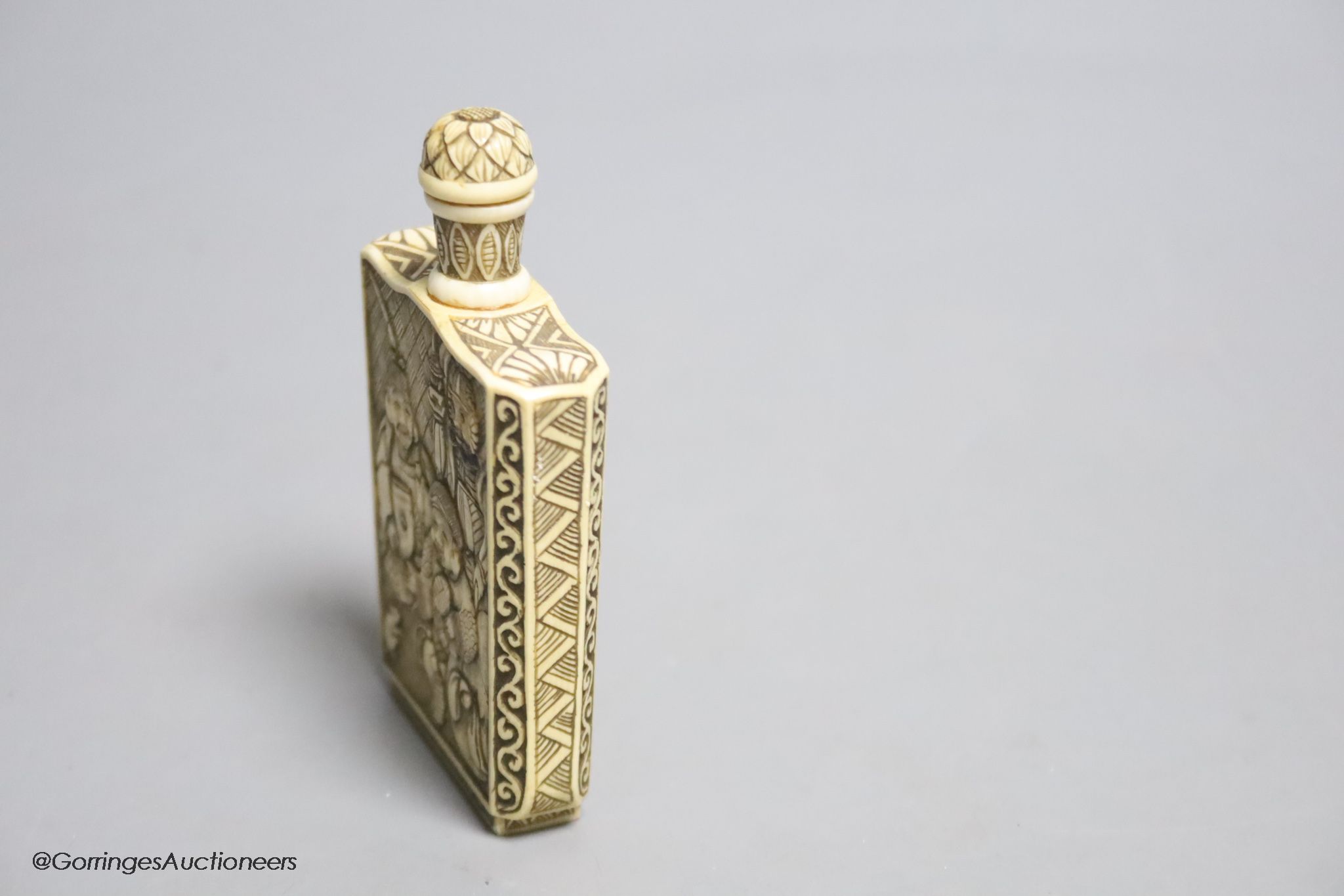 A Japanese carved ivory ‘Gods of Happiness’ snuff bottle, early 20th century